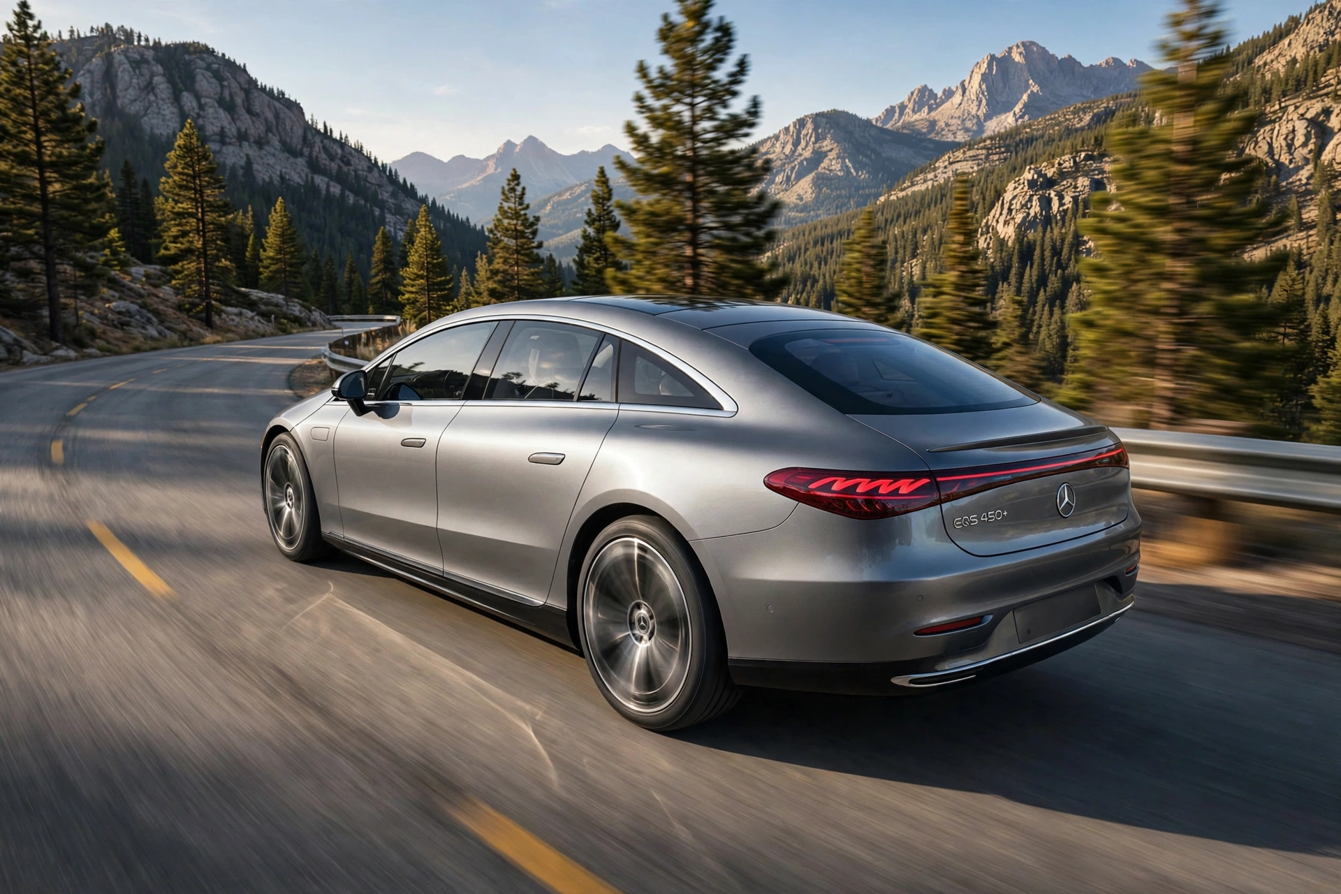 Silver Mercedes-Benz EQS 450+ sedan driving fast on a winding mountain road, the smooth one-bow flagship mercedes ev at speed